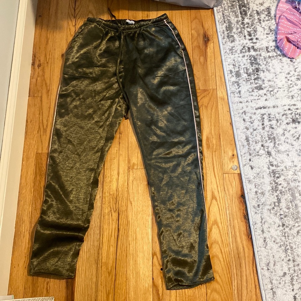 Dark green silk pants with pink stripe down the side